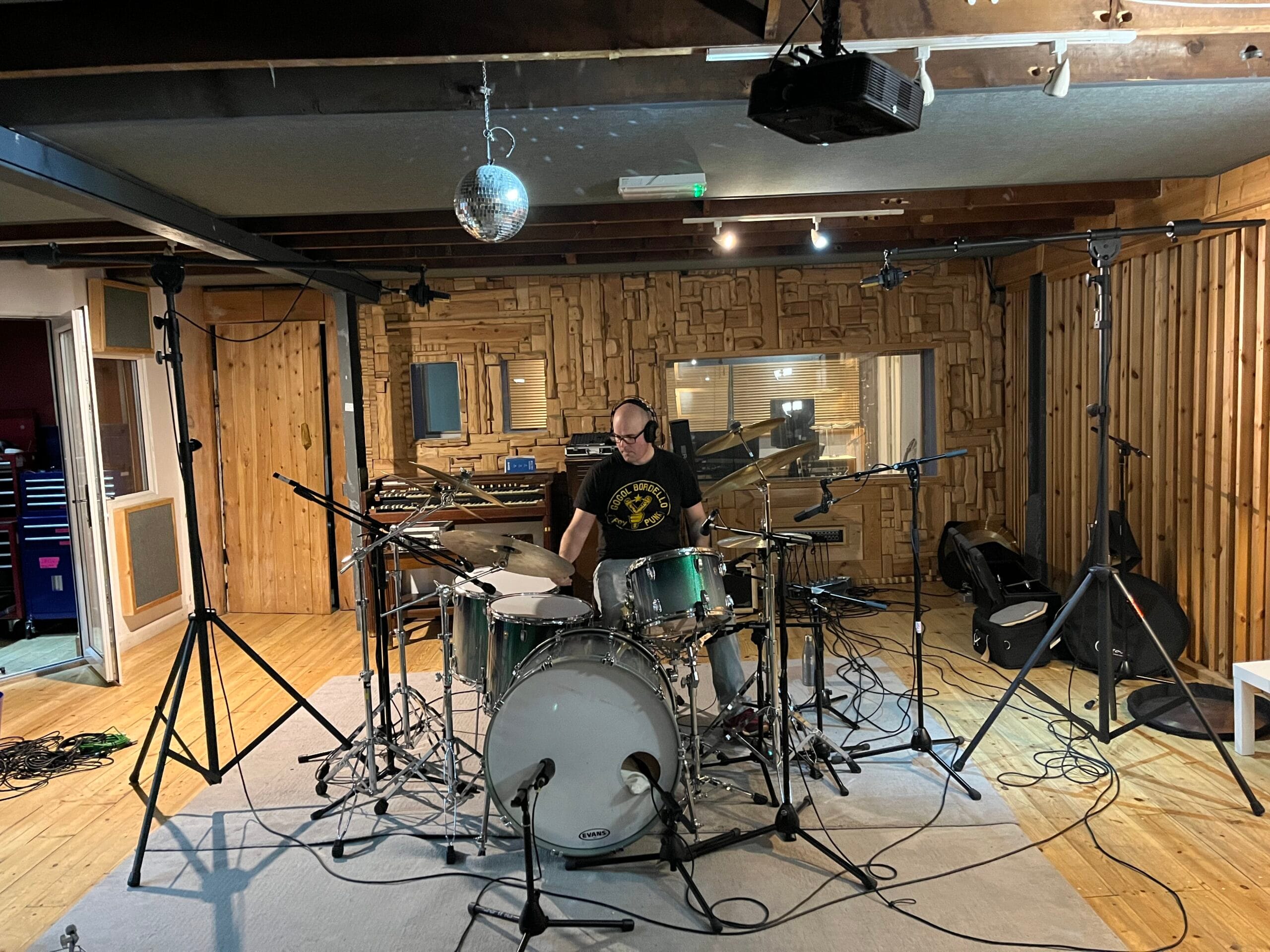 Drum recording session at partner studio in Newcastle, with drummer at kit — professional recording services